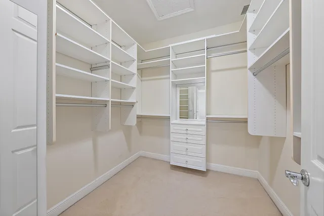 a view of an empty walk in closet