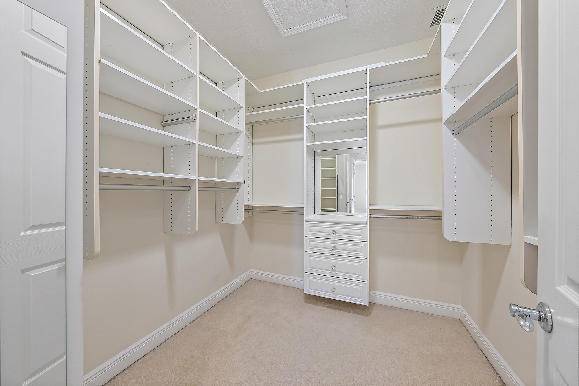 141 Morning Dew Circle Jupiter, FL 33458 - Photo 13 of 22 a view of an empty walk in closet