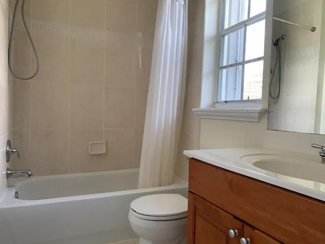 a bathroom with a sink a toilet and a bathtub