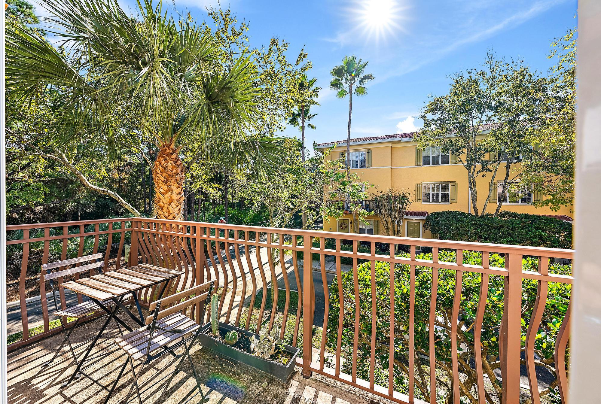 141 Morning Dew Circle Jupiter, FL 33458 - Photo 20 of 22 a view of a balcony with wooden floor and fence