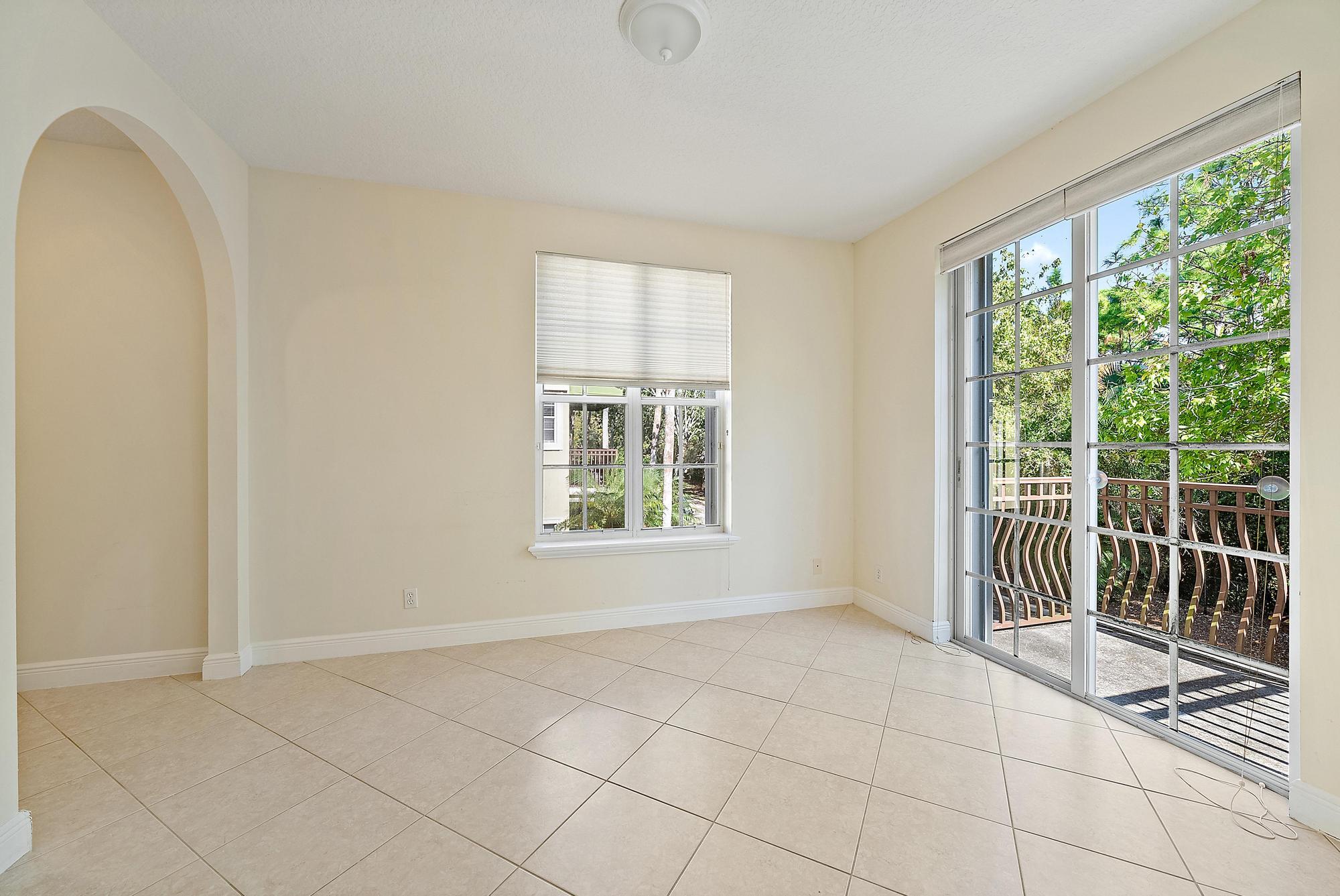 141 Morning Dew Circle Jupiter, FL 33458 - Photo 9 of 22 a view of an empty room with a window