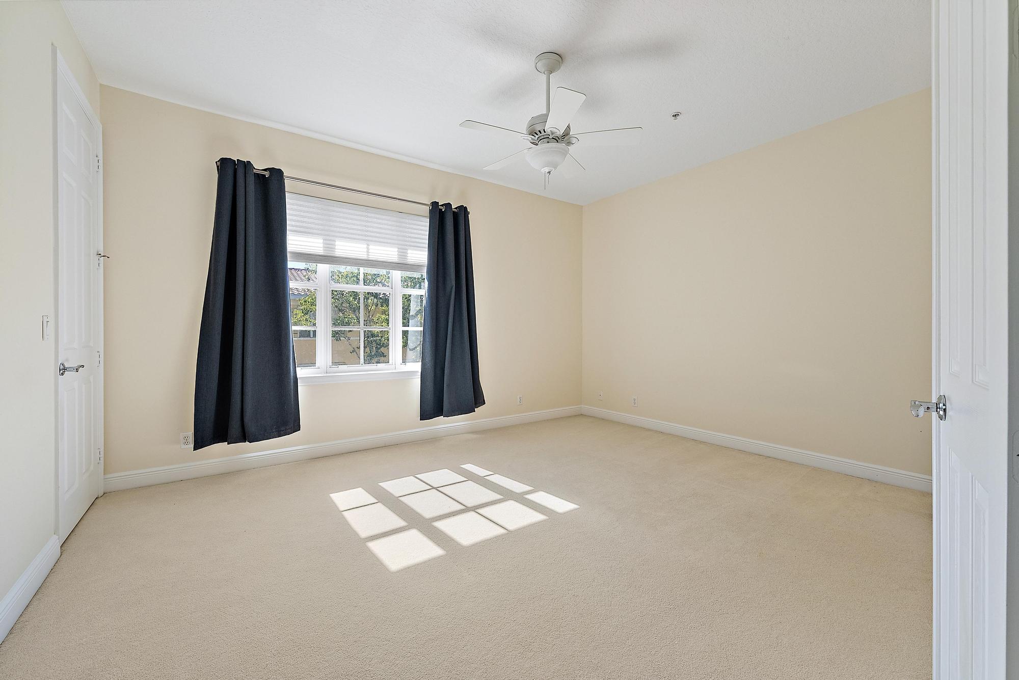 141 Morning Dew Circle Jupiter, FL 33458 - Photo 10 of 22 a view of an empty room with a window