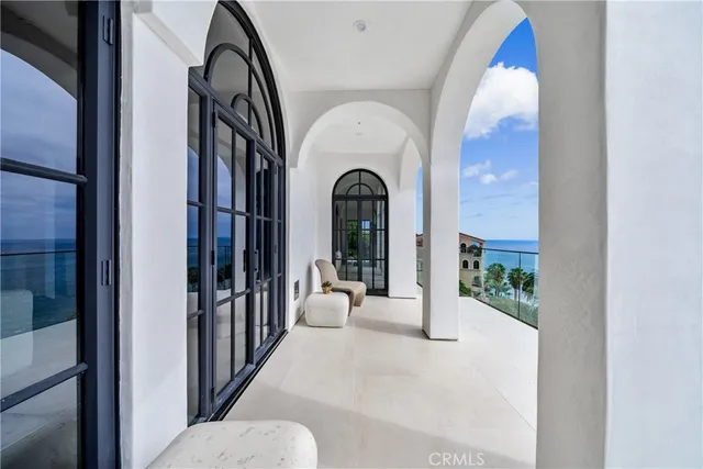 a view of a balcony with lake view and living room
