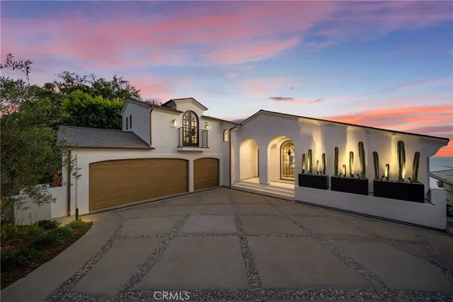 a living room with furniture fireplace and a large window