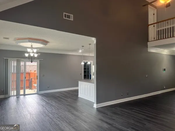 a large bed sitting in a bedroom next to a cabinet