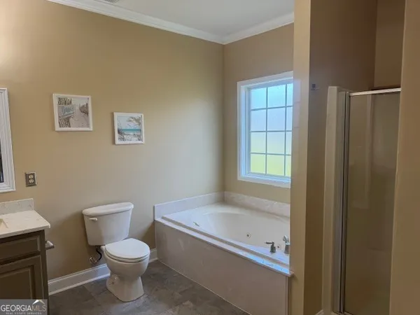 a white toilet sitting next to a bathroom sink
