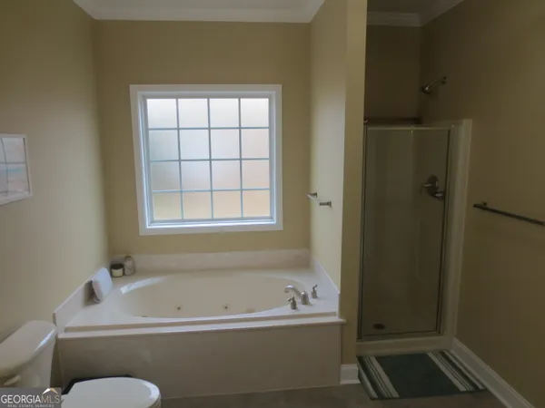a white toilet sitting next to a small sink