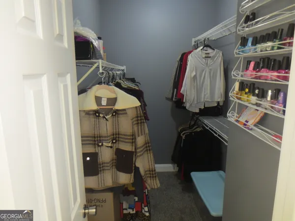 a dining room with furniture and musical instruments
