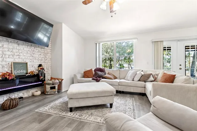a living room with furniture window and a fireplace