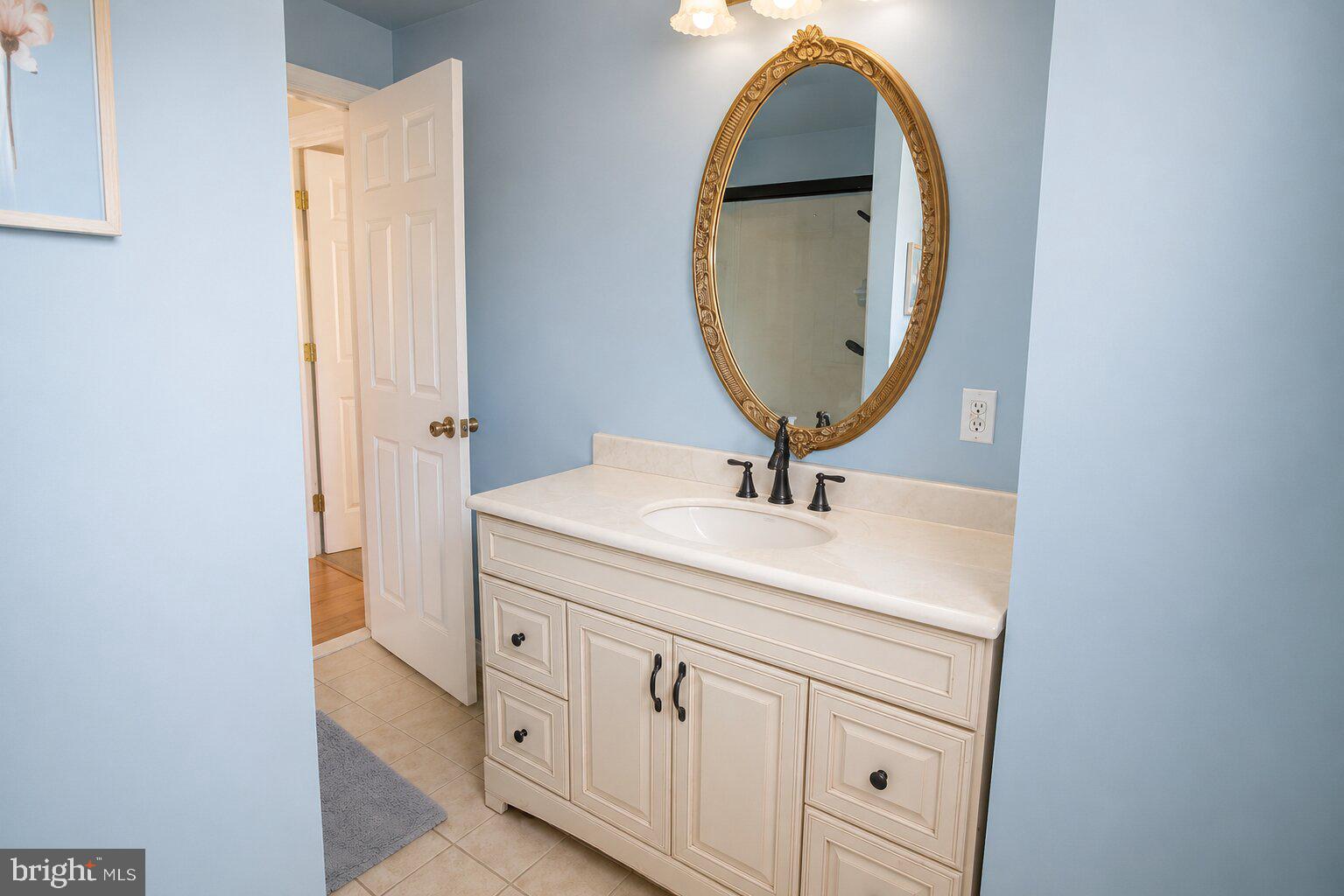 100 Grant Street Riverside, NJ 08075 - Photo 23 of 34 a bathroom with a sink and a mirror