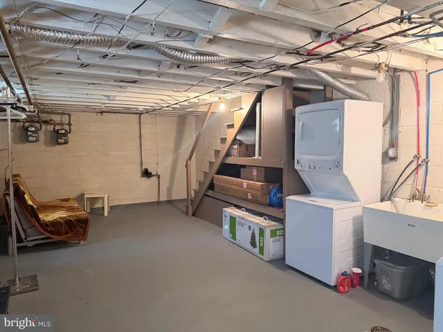 a view of an empty room with stairs