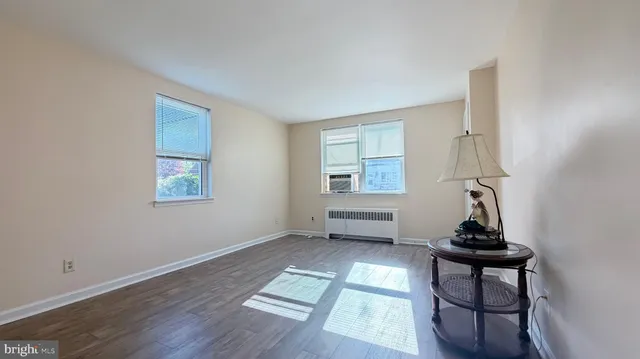 a room that has a window and a table in it