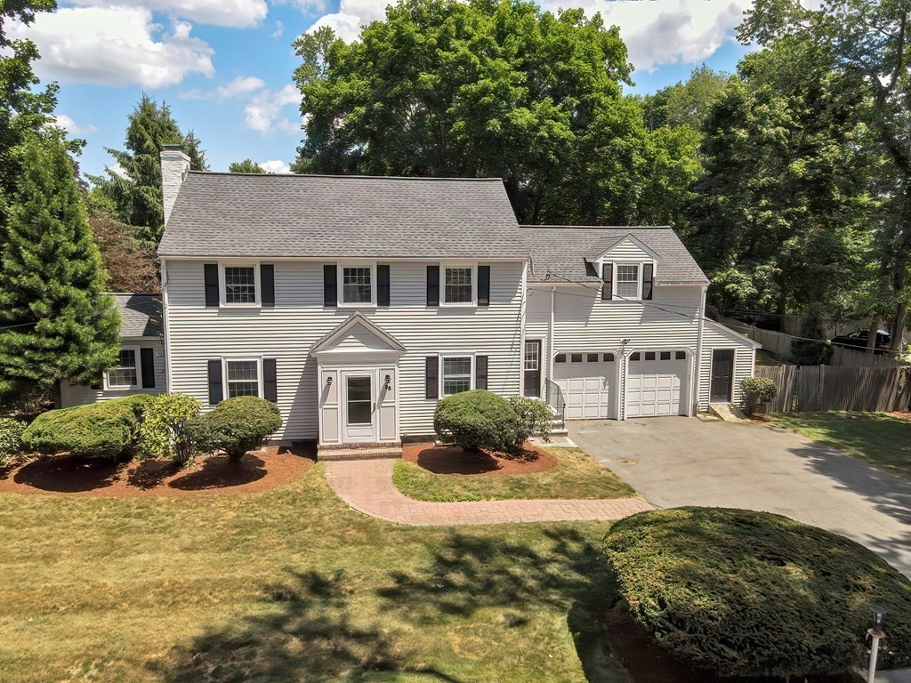 38 Hidden Road Andover, MA 01810 - Photo 1 of 31 a front view of a house with yard and green space