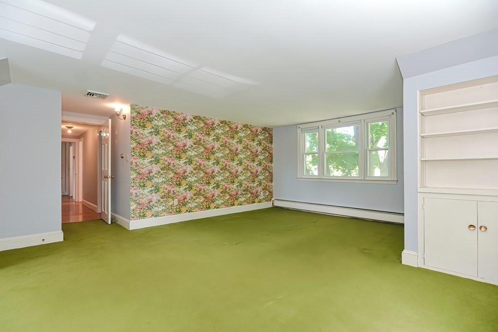 38 Hidden Road Andover, MA 01810 - Photo 16 of 31 a view of an empty room with a window