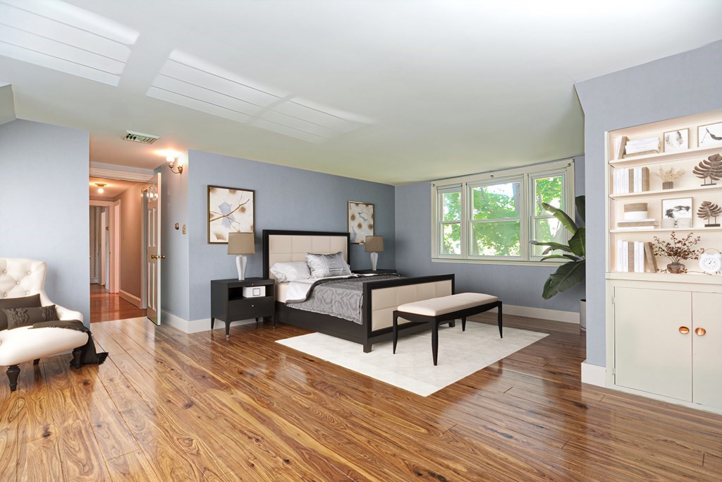38 Hidden Road Andover, MA 01810 - Photo 29 of 31 a living room with furniture and a wooden floor