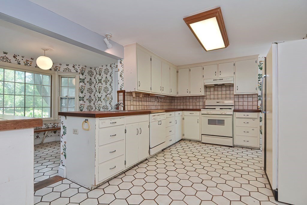 38 Hidden Road Andover, MA 01810 - Photo 3 of 31 a kitchen with cabinets appliances and a window
