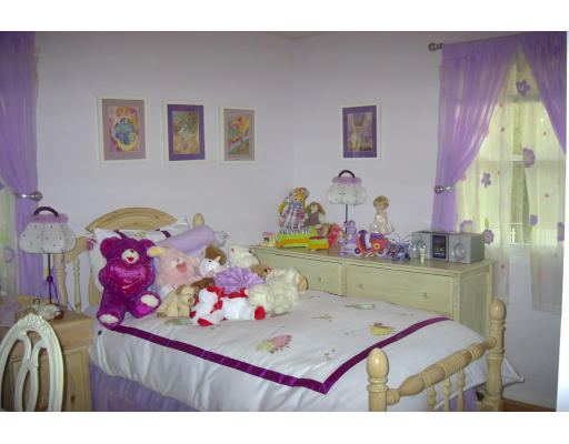 10 Pamela Road Framingham, MA 01701 - Photo 6 of 9 a room with furniture and baby bed