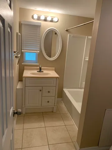 a bathroom with a toilet and a window