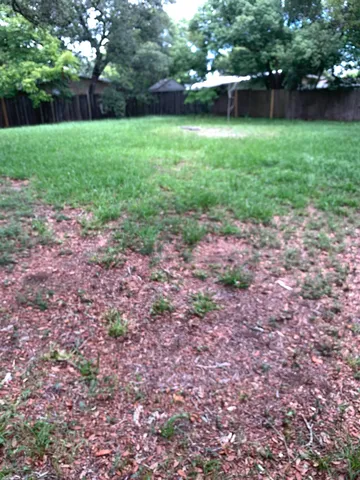 a view of a house with a yard porch and sitting area