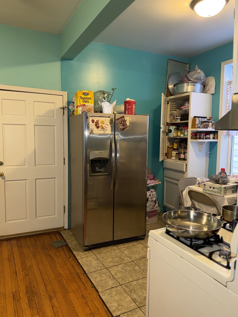 10045 South Ave M Chicago, IL 60617 - Photo 15 of 25 a room with storage and utility
