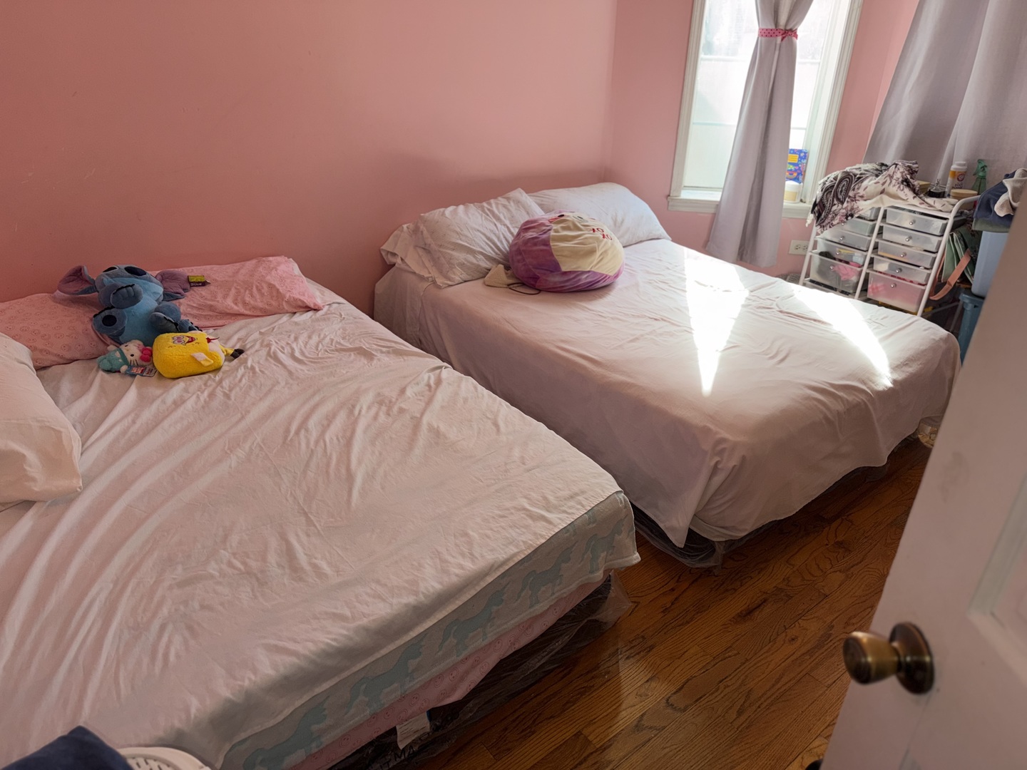 10045 South Ave M Chicago, IL 60617 - Photo 18 of 25 a bedroom with two beds and wooden floor