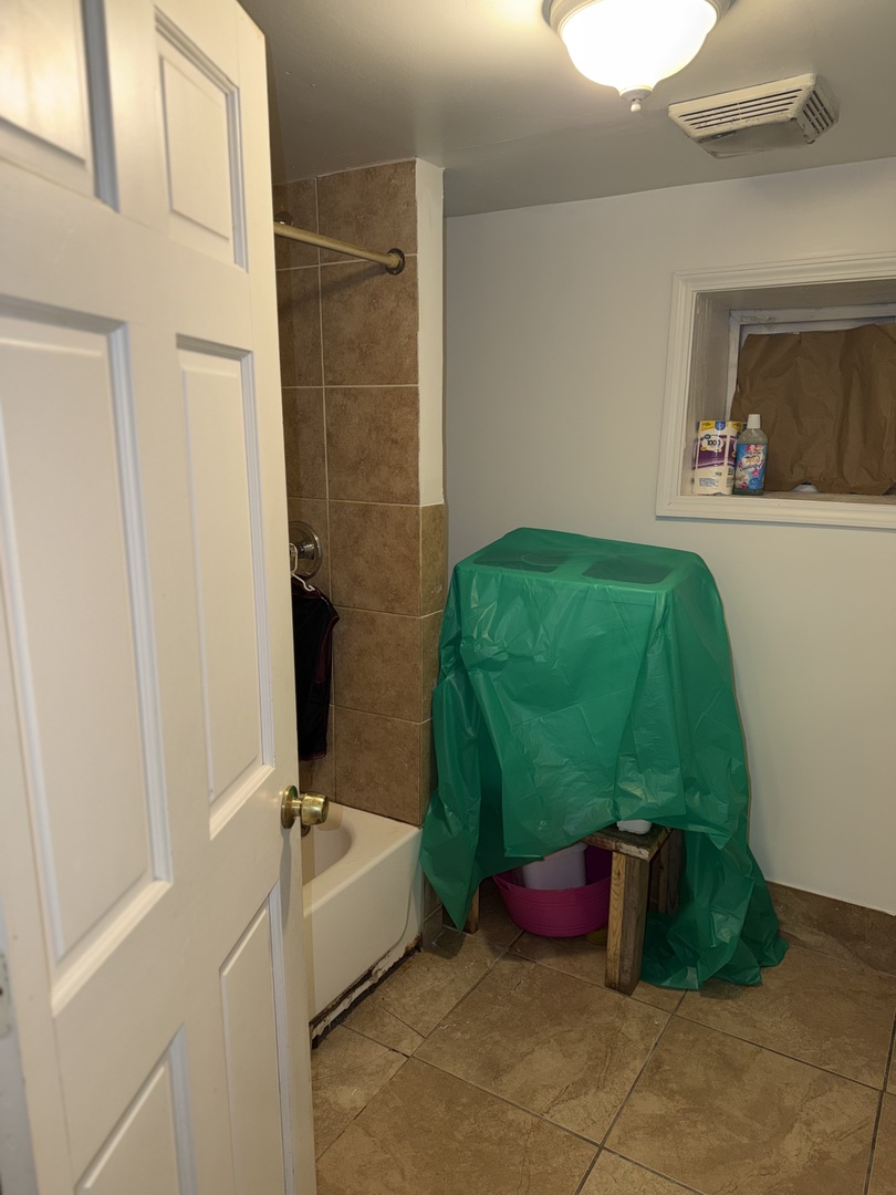 10045 South Ave M Chicago, IL 60617 - Photo 21 of 25 a bathroom with a sink and a mirror