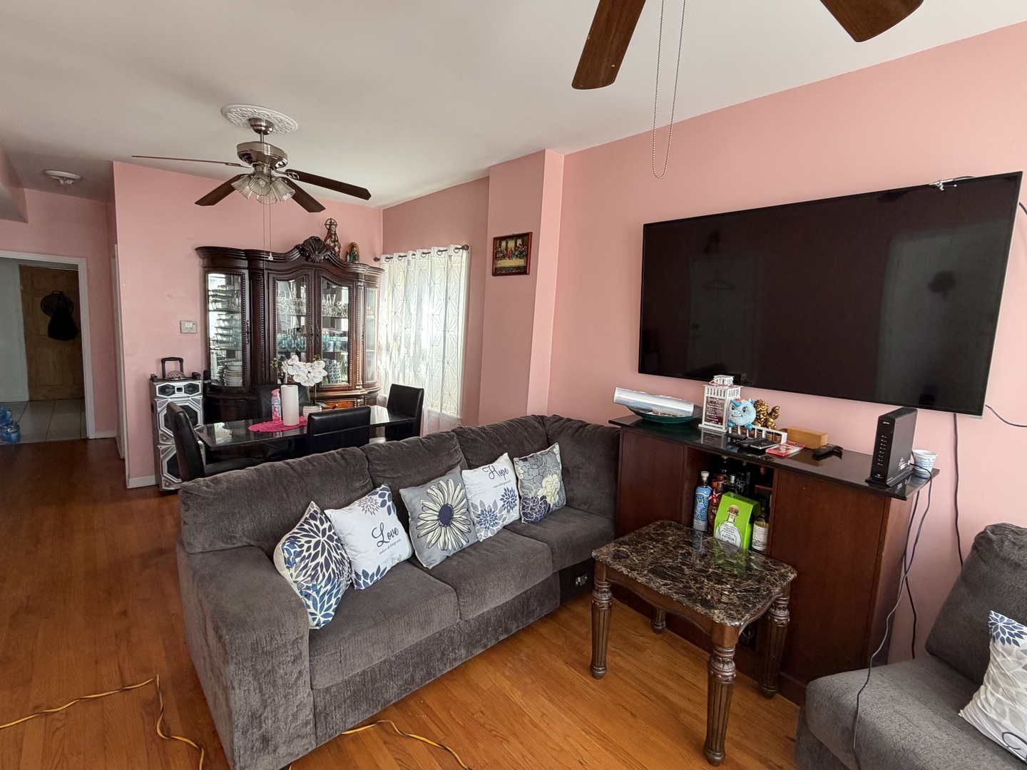 10045 South Ave M Chicago, IL 60617 - Photo 4 of 25 a living room with furniture and a flat screen tv