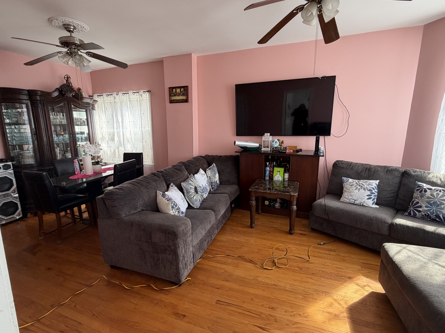 10045 South Ave M Chicago, IL 60617 - Photo 5 of 25 a living room with furniture and a flat screen tv