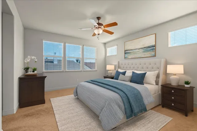 a bedroom with a large bed and a window