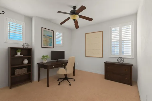 a workspace with furniture and window