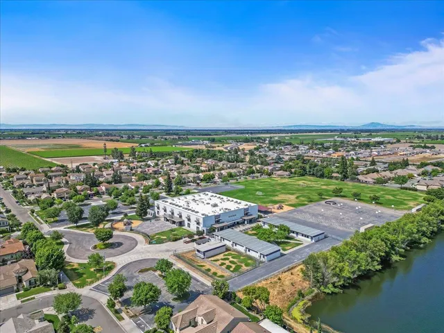 an aerial view of multiple house with outdoor space