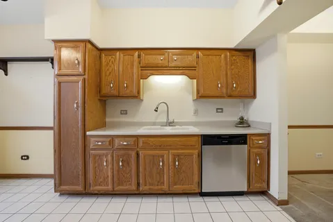 a kitchen with a sink and cabinets