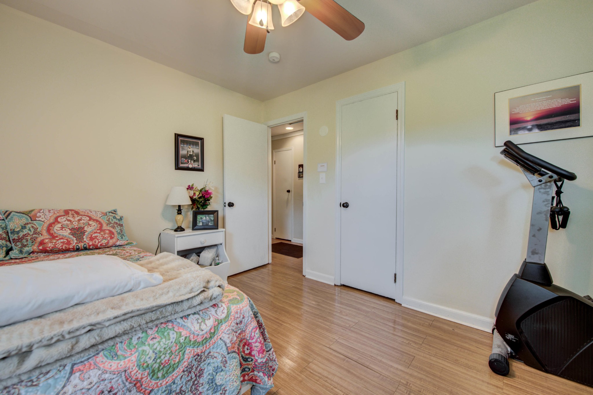517 Foust Carney Road Powell, TN 37849 - Photo 18 of 28 a bedroom with a bed and a chandelier