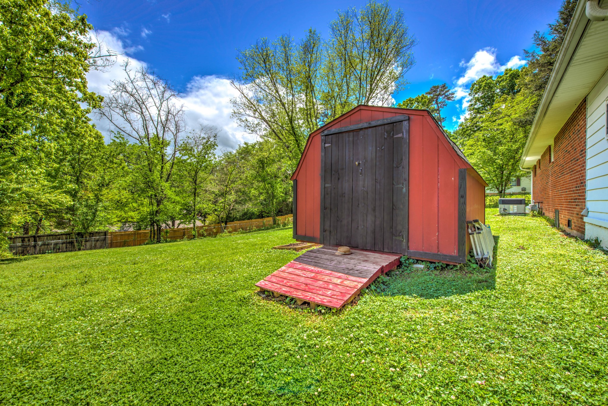 517 Foust Carney Road Powell, TN 37849 - Photo 22 of 28 a view of a backyard with a small cabin