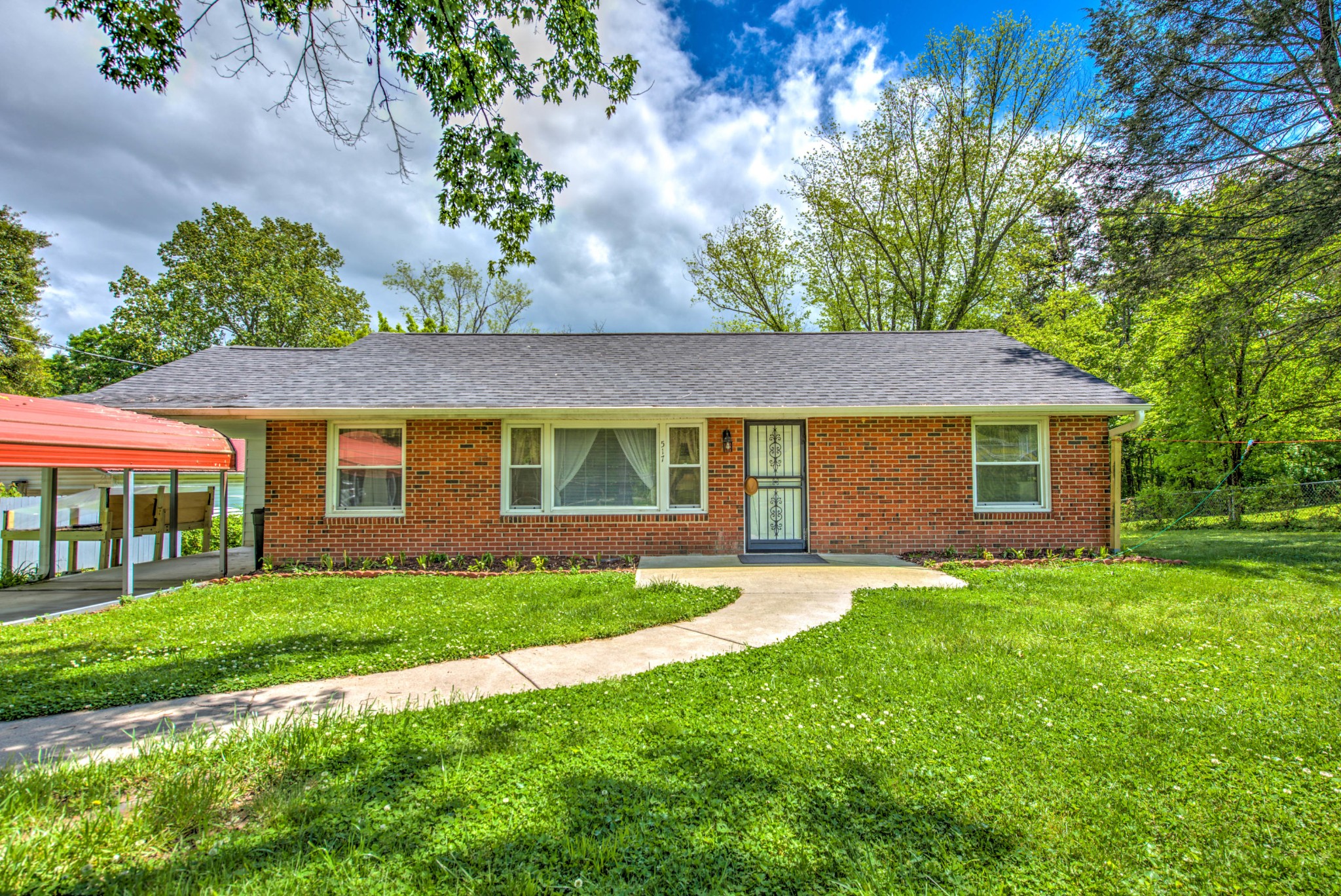 517 Foust Carney Road Powell, TN 37849 - Photo 24 of 28 a front view of a house with a yard