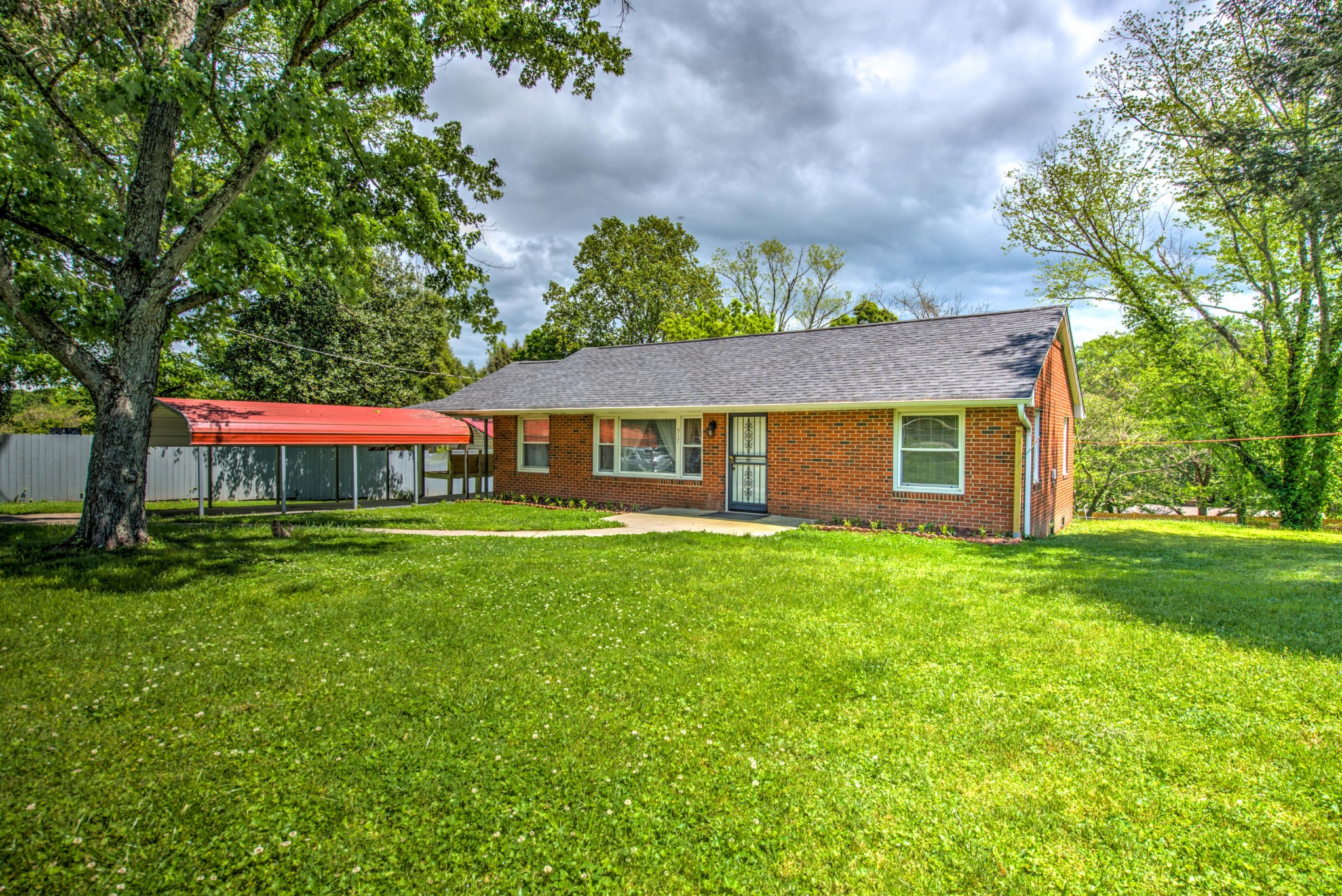 517 Foust Carney Road Powell, TN 37849 - Photo 25 of 28 a front view of a house with a garden