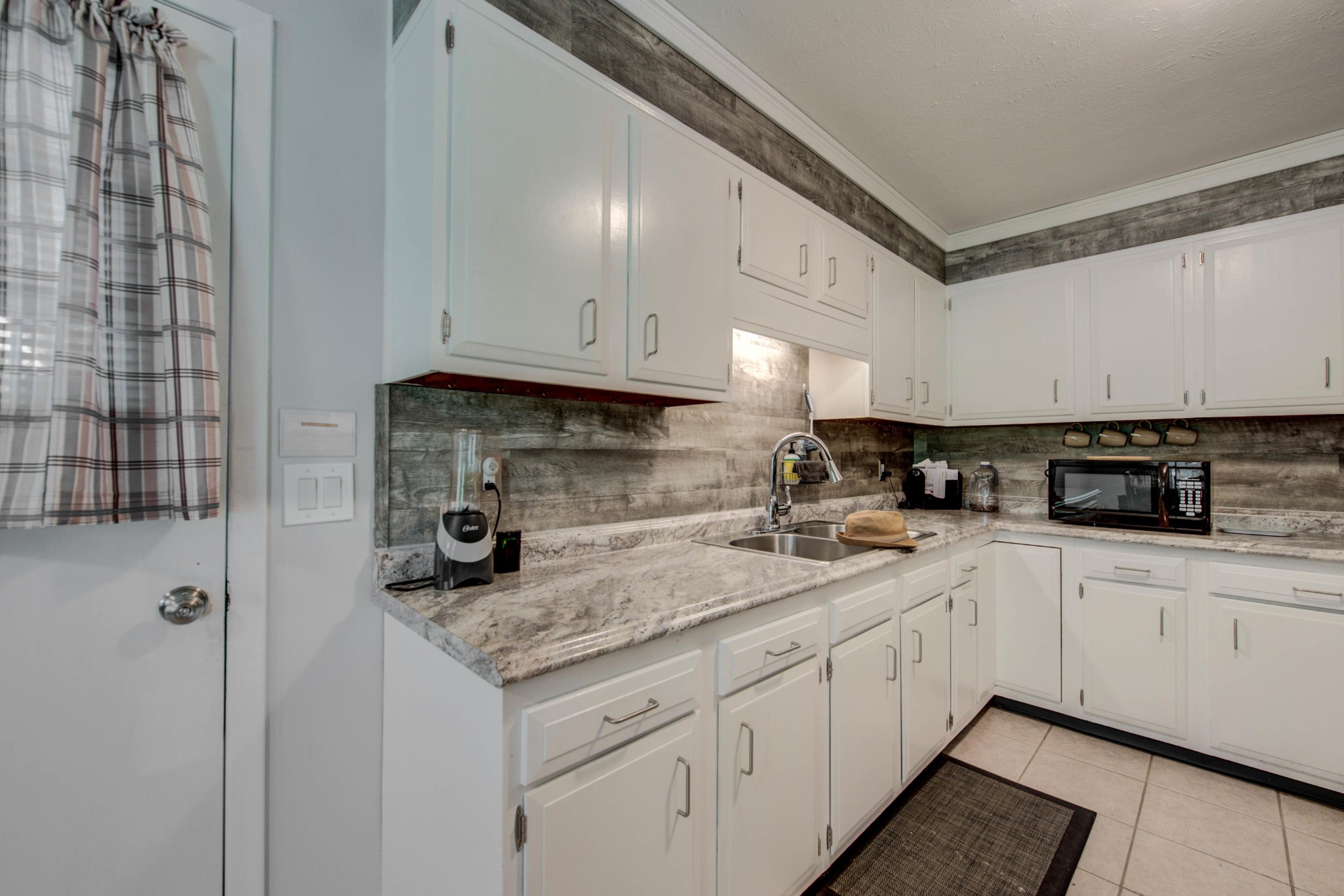 517 Foust Carney Road Powell, TN 37849 - Photo 8 of 28 a kitchen with stainless steel appliances granite countertop a sink stove and cabinets