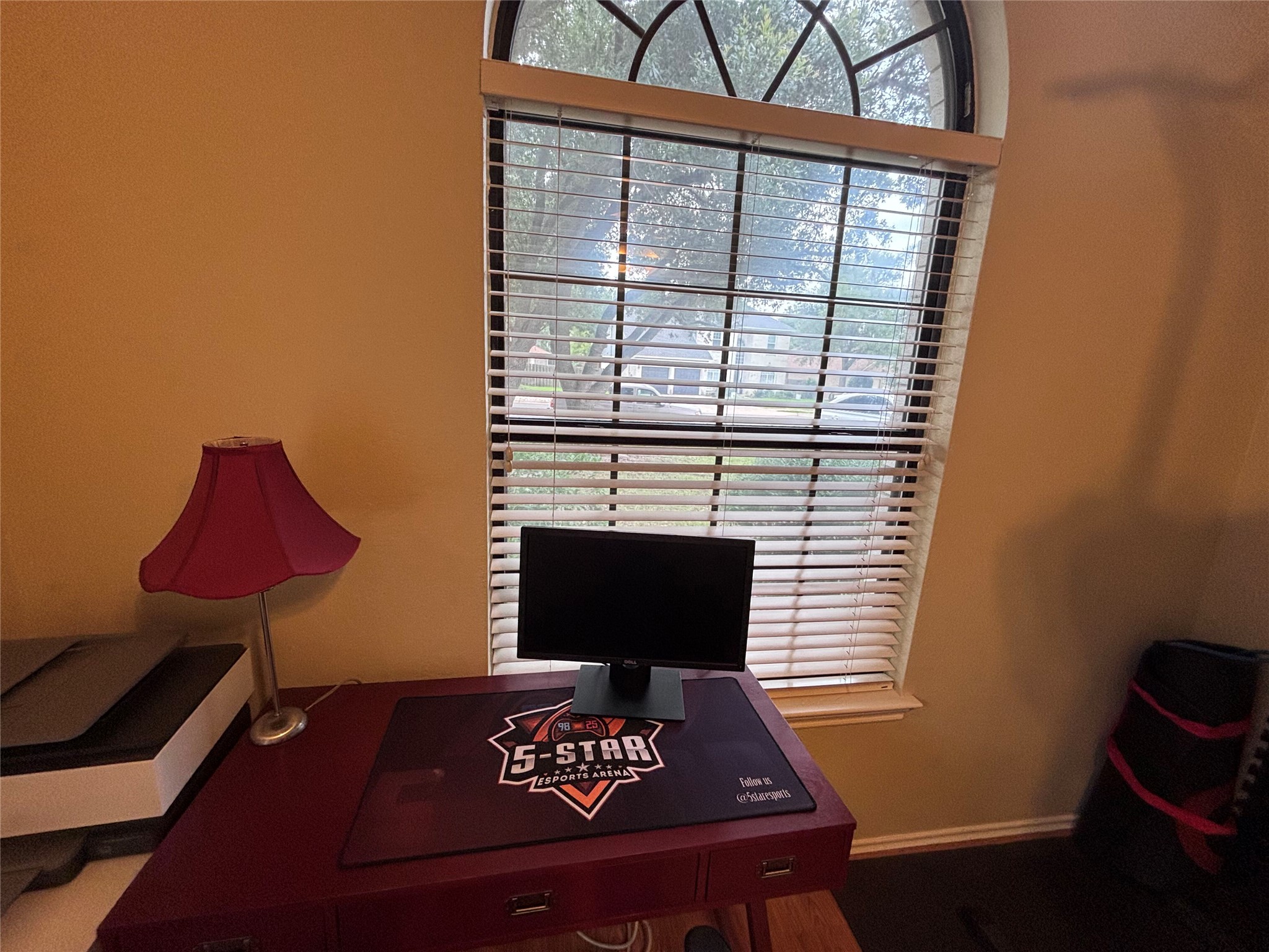 1316 Mesquite Road Cedar Park, TX 78613 - Photo 20 of 24 An arched window provides abundant natural light, creating a pleasant workspace.