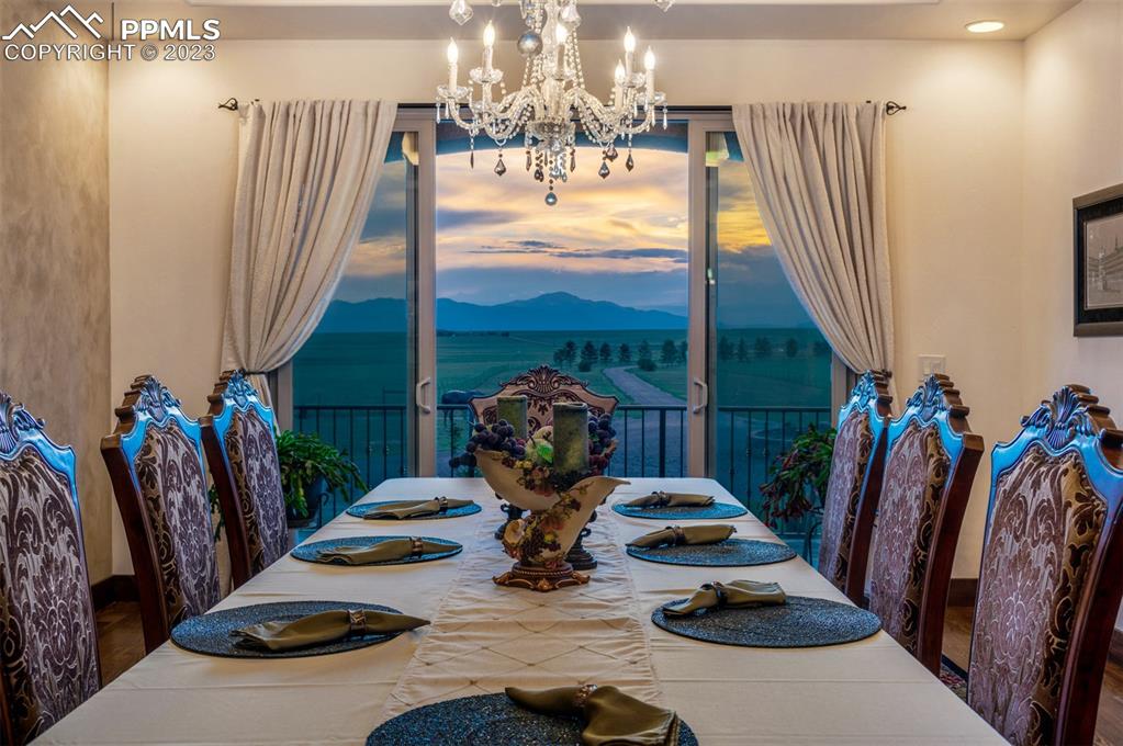19625 Drennan Road Colorado Springs, CO 80928 - Photo 12 of 50 Main Level - Formal Dining Room with walkout facing the mountains.