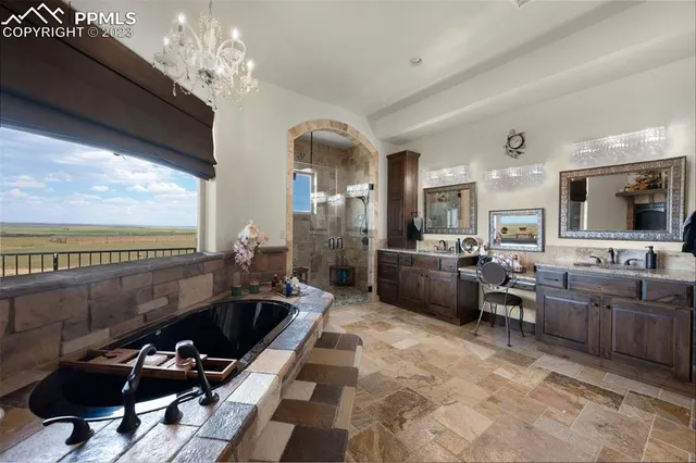 a kitchen with stainless steel appliances granite countertop sink stove top oven and cabinets