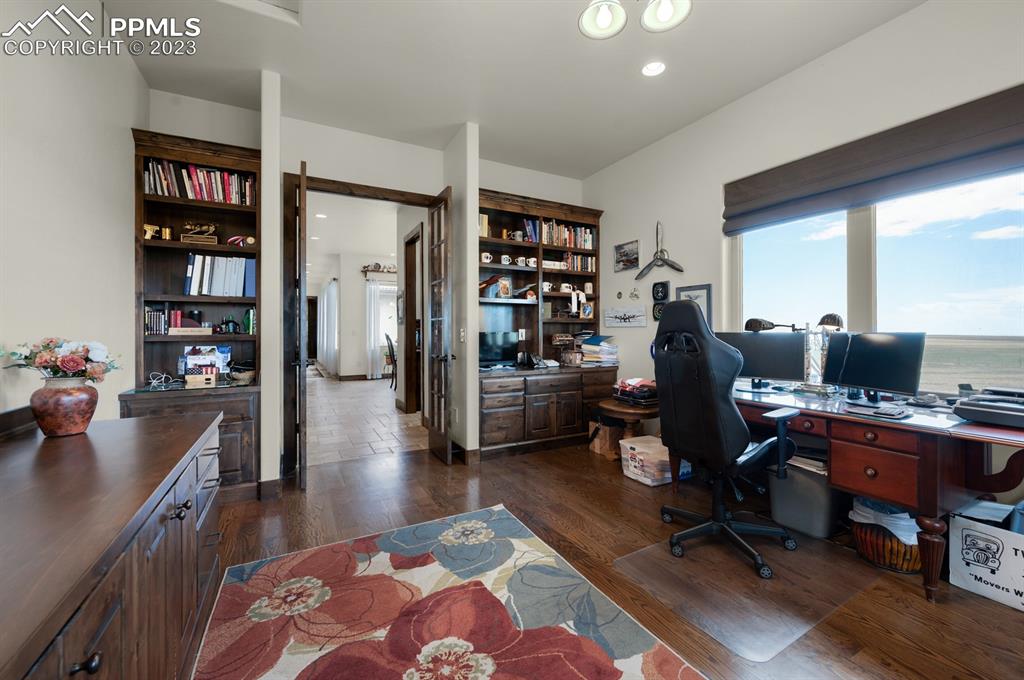 19625 Drennan Road Colorado Springs, CO 80928 - Photo 25 of 50 Main Level - Office with western and southern views of the ranch and mountains.
