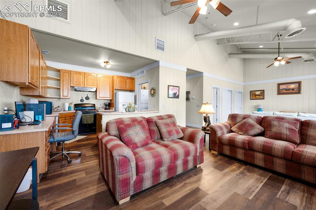 19625 Drennan Road Colorado Springs, CO 80928 - Photo 36 of 50 a living room with furniture a couch and a chandelier