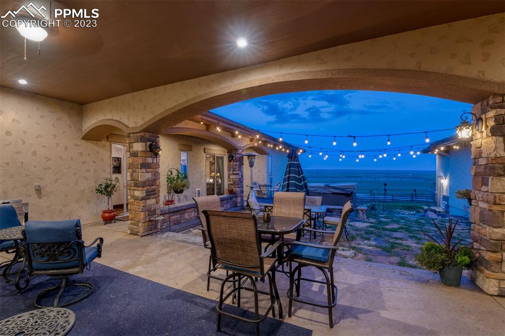 19625 Drennan Road Colorado Springs, CO 80928 - Photo 45 of 50 a view of a dining room with furniture and chandelier