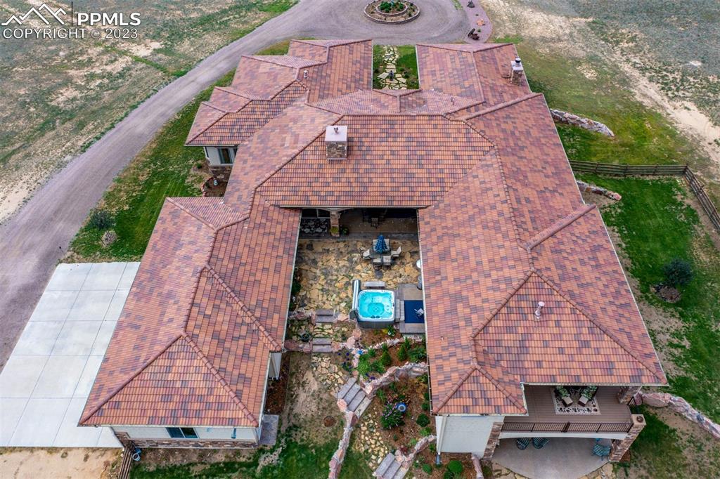 19625 Drennan Road Colorado Springs, CO 80928 - Photo 6 of 50 an aerial view of a house with a yard