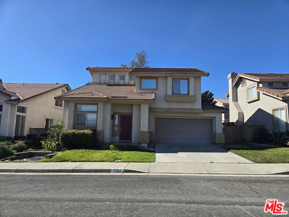 7254 Brienza Place Rancho Cucamonga, CA 91701 - Photo 1 of 17 a front view of a house with a yard and garage