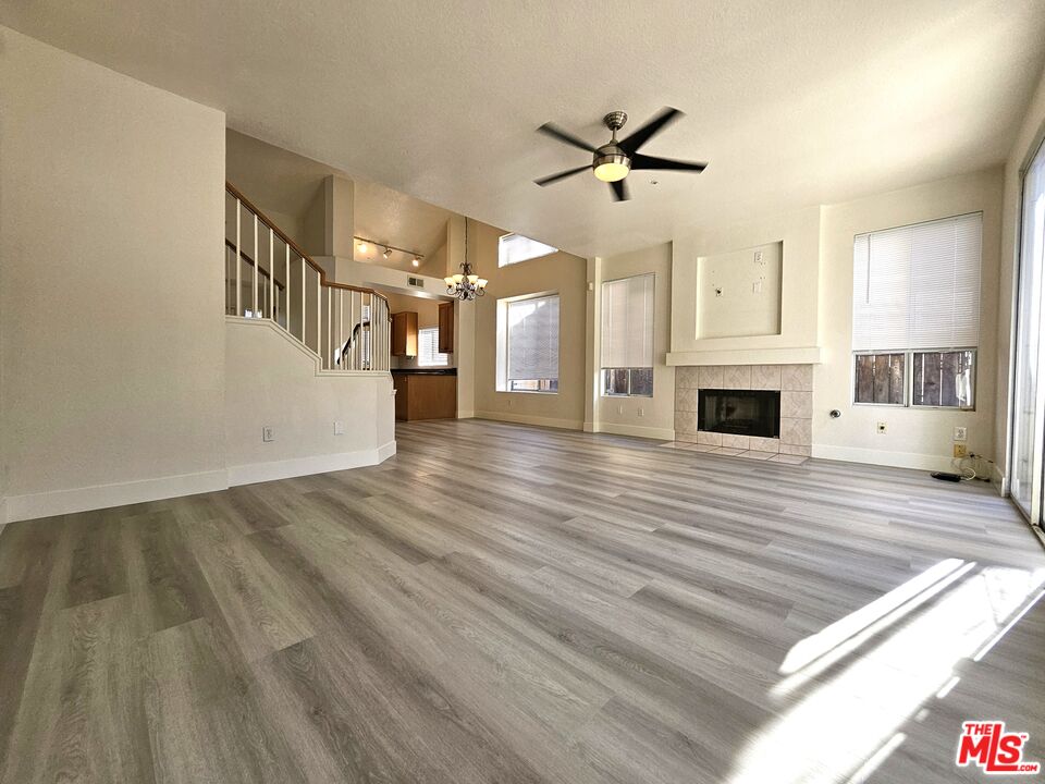 7254 Brienza Place Rancho Cucamonga, CA 91701 - Photo 5 of 17 a view of livingroom kitchen and hall with wooden floor