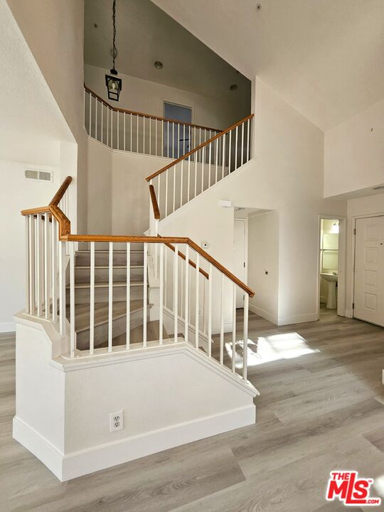7254 Brienza Place Rancho Cucamonga, CA 91701 - Photo 6 of 17 a view of staircase with railing and white walls