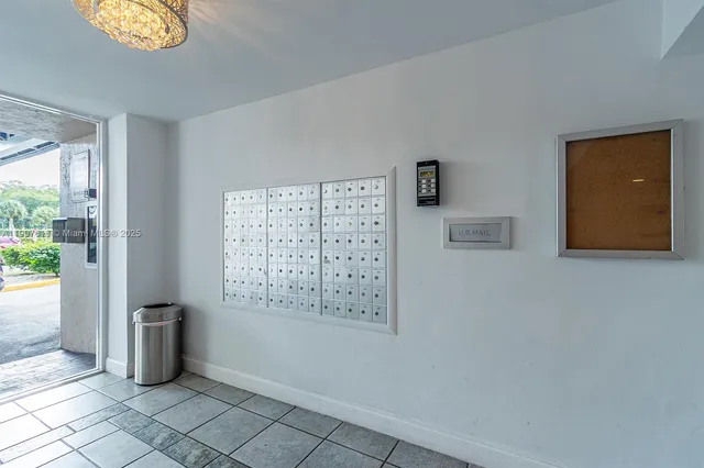 a view of a hallway with paintings on the wall