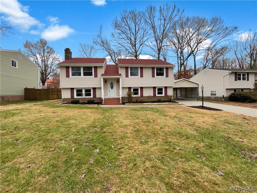 9407 Emmett Road Glen Allen, VA 23060 - Photo 1 of 18 a front view of a building with swimming pool