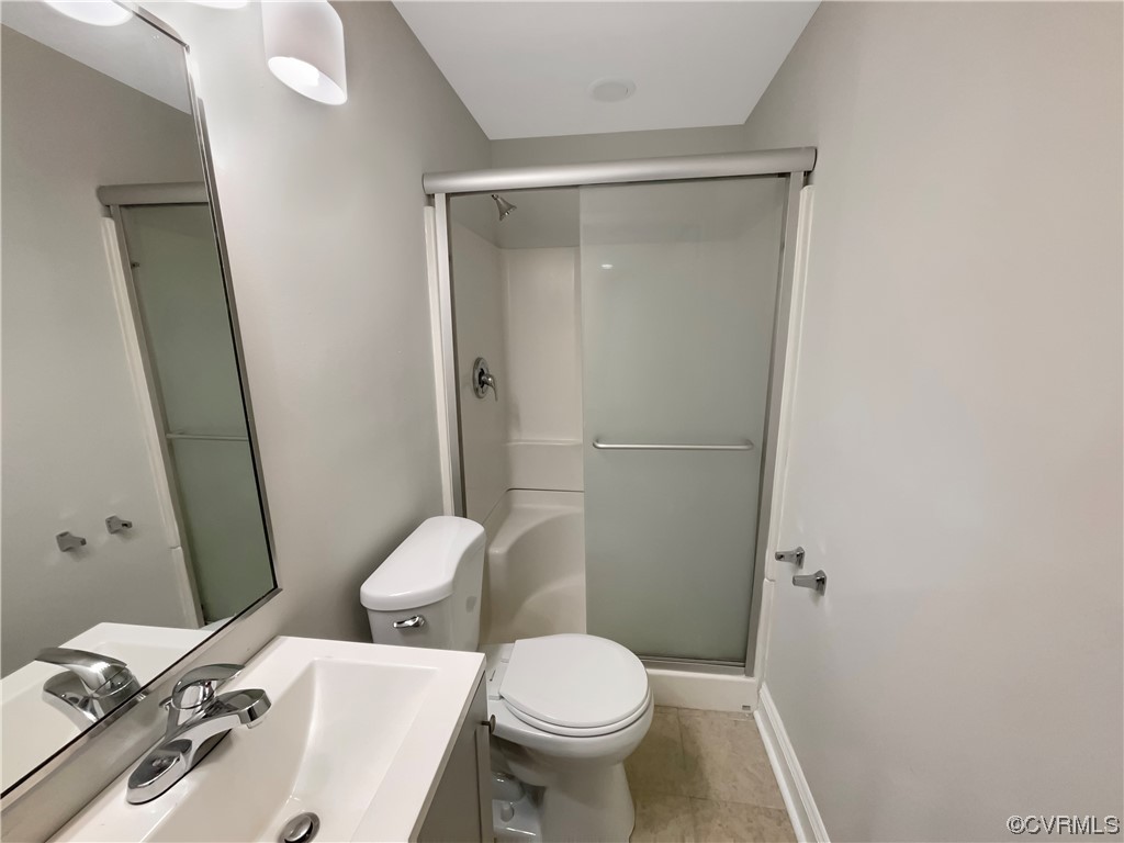 9407 Emmett Road Glen Allen, VA 23060 - Photo 11 of 18 a white toilet sitting next to a bathroom sink
